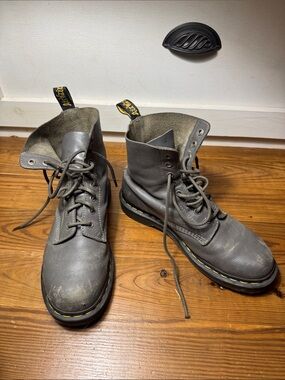 well worn beaten up used doc martens grey combat boot